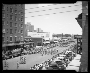 Parade on Broadway Avenue aerial view to the east, circa 1940’s- Photo courtesy of the Winston Reeves Collection, Southwest Collection/Special Collections Library